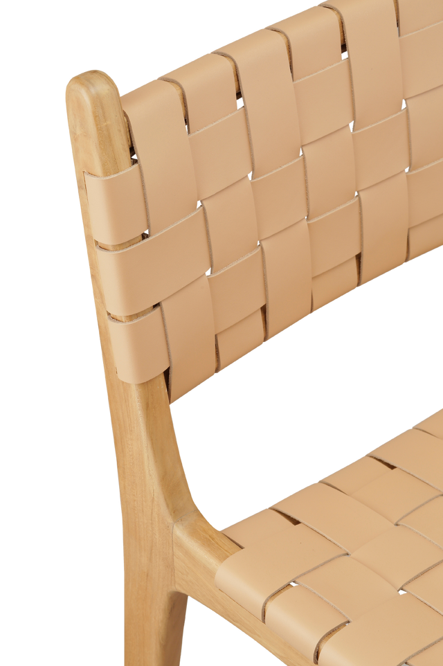 Close up view of the leather. A wooden counter stool with a woven tan leather seat and back, shown against a transparent background.