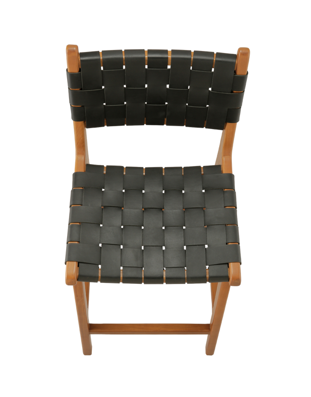 View of the top.  A wooden counter stool with a woven black leather seat and back, shown against a transparent background.