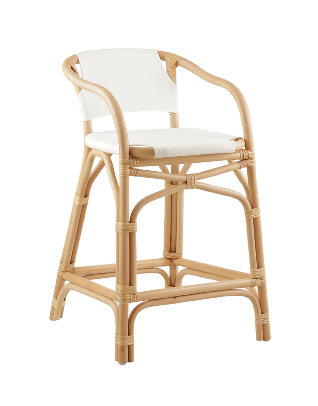 A natural rattan-style counter stool with a curved frame, white padded seat and back, and woven accents, shown against a transparent background.