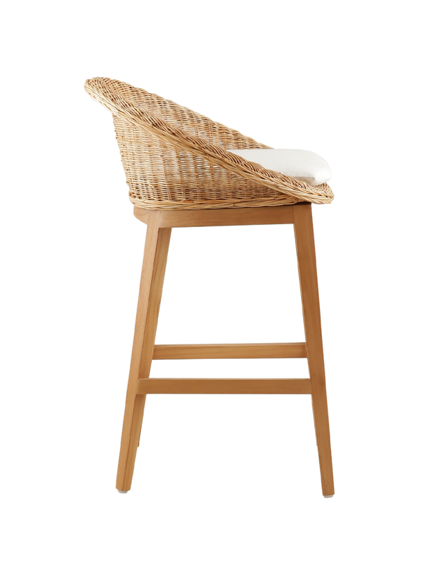 Side View. cozy counter stool with a round woven rattan seat and a white cushioned cushion for added comfort. The stool features a wooden frame with four legs, offering a natural and rustic look. The design is simple yet elegant, ideal for a casual dining area or kitchen bar.