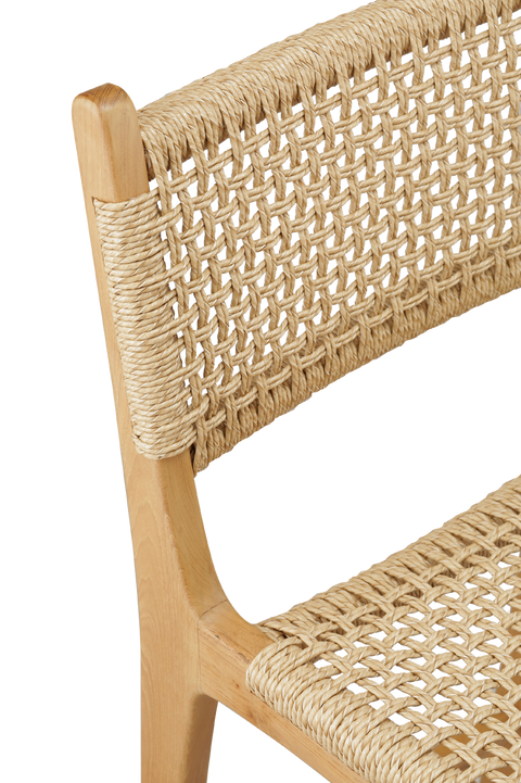 counter stool with a woven rattan seat and backrest. The backrest is woven in a diagonal pattern, creating a more textured, crisscross appearance. The seat features a similar woven style, with a smooth and rounded shape for added comfort. detailed view 