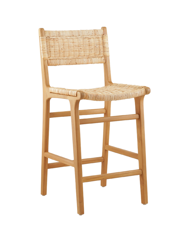 3/4 view. A wooden counter stool featuring a woven rattan seat and back, shown against a transparent background