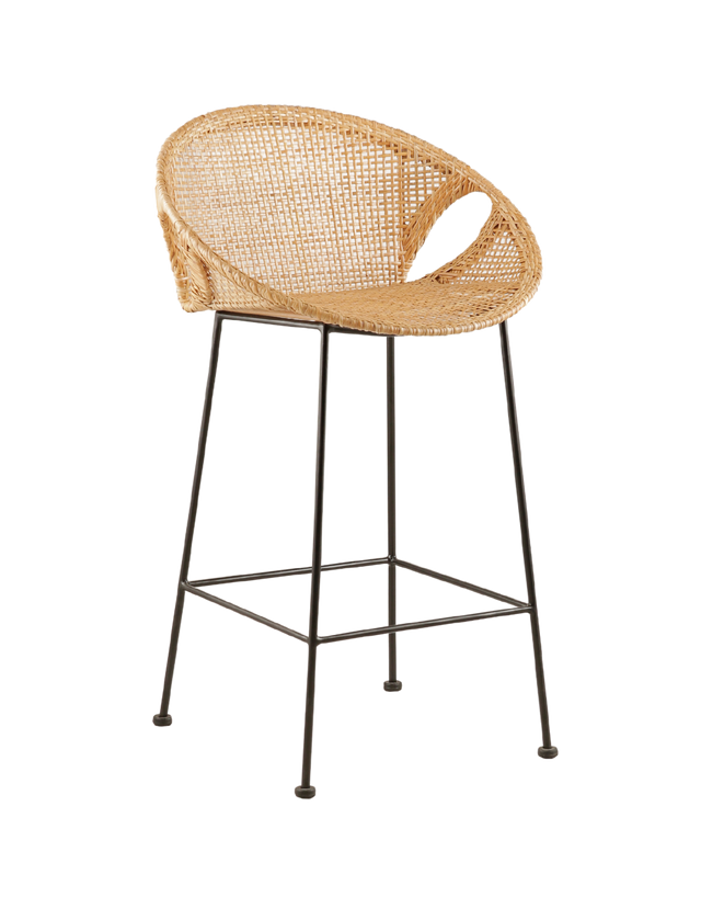 stylish counter stool with a round, woven rattan seat. The seat is supported by slim black metal legs, offering a modern contrast to the natural texture of the rattan. The design features small cut-out sections at the sides of the seat. 3/4 view