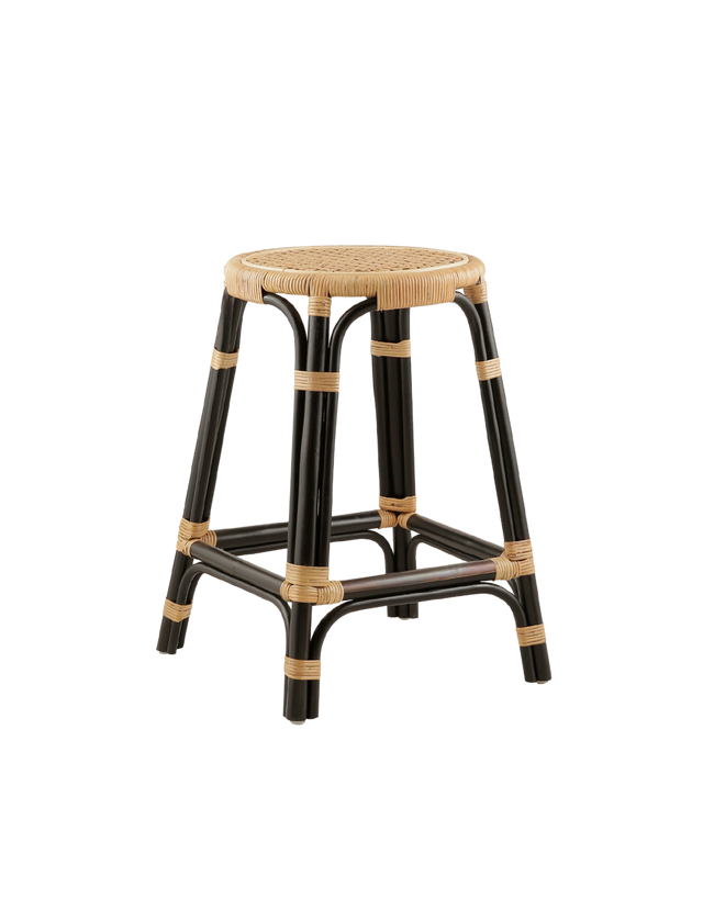 counter stool with a woven rattan seat and a black-painted frame. The frame is crafted from rattan, with intricate weaving details where the legs meet the seat, adding texture and contrast. The overall design combines natural elements with a modern, bold black finish for a stylish and contemporary look.