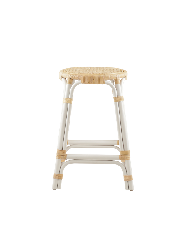 A rattan counter stool with a round woven seat and white frame accented with natural rattan bindings, shown against a transparent background.