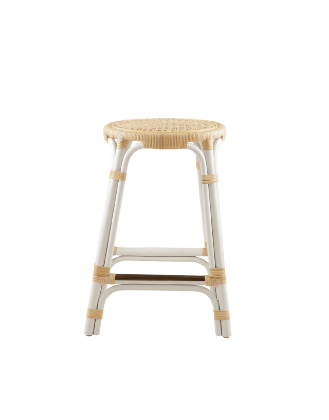 A rattan counter stool with a round woven seat and white frame accented with natural rattan bindings, shown against a transparent background.