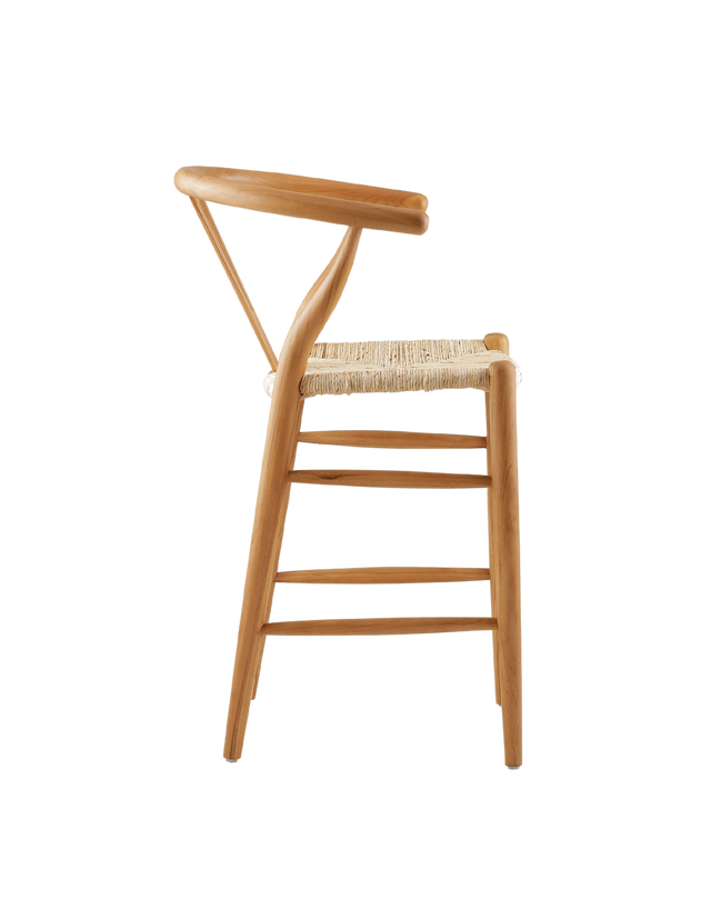 counter stool made from teak wood with a woven seat. The stool features a classic design with a curved backrest and straight legs. The natural wood finish highlights the rich grain of the teak, giving it a timeless, rustic charm. Side view